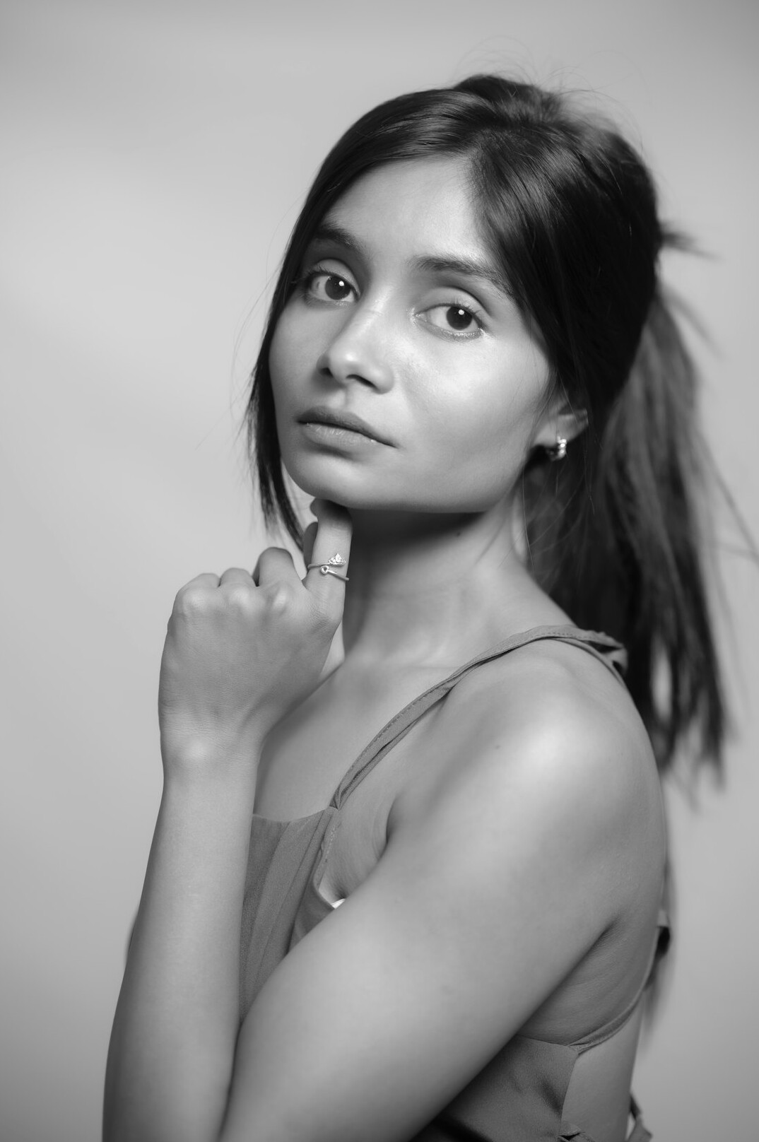 Studio portrait of a young Latina photo editor