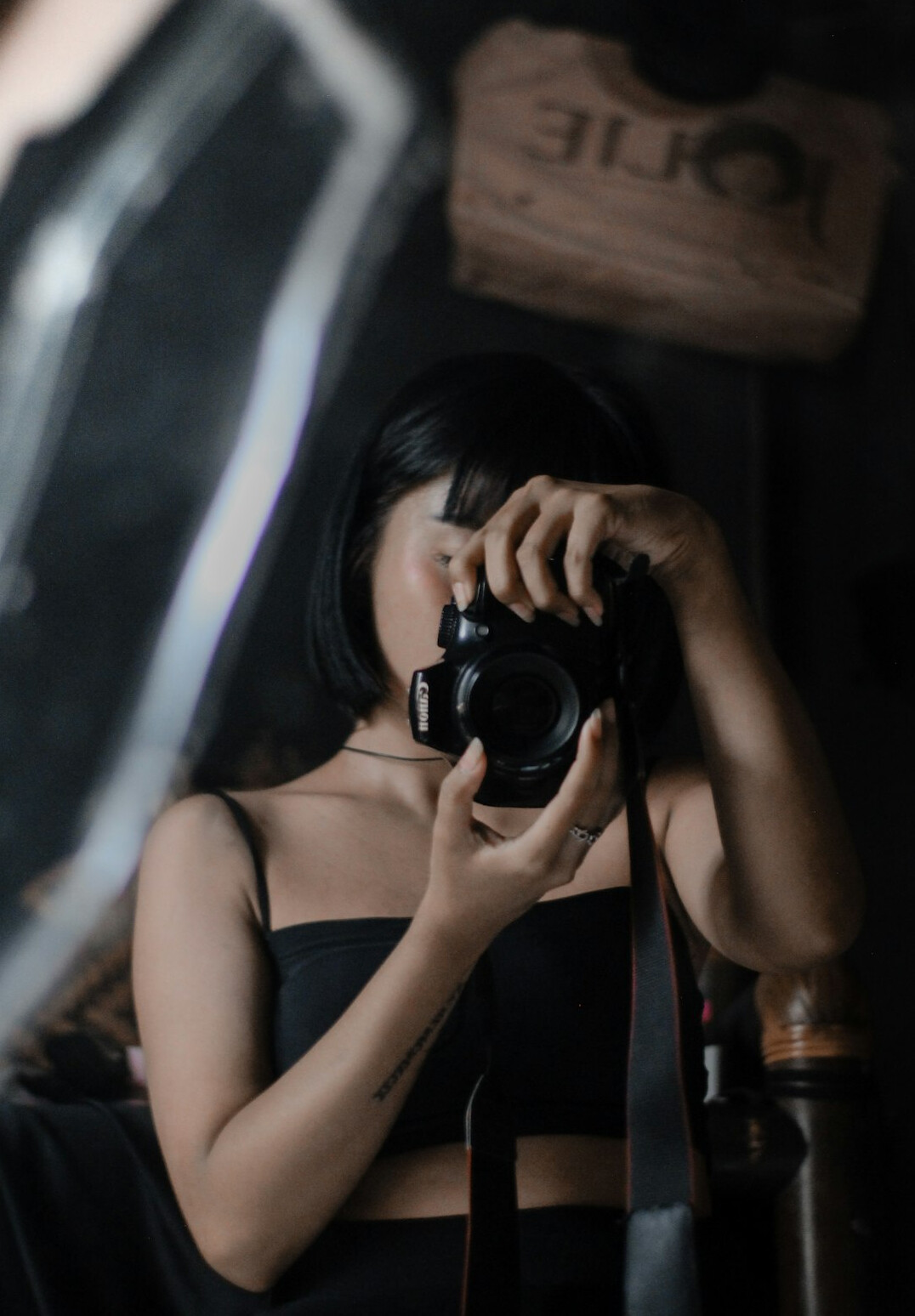 Studio portrait of a Latina female photographer smiling
